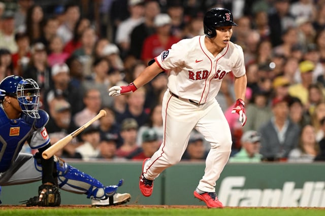 BOSTON, MASSACHUSETTS - AUGUST 06: Masataka Yoshida #7 of the Boston Red Sox hits a ground out to center during the seventh inning of a game against the Kansas City Royals at Fenway Park on August 06, 2025 in Boston, Massachusetts.