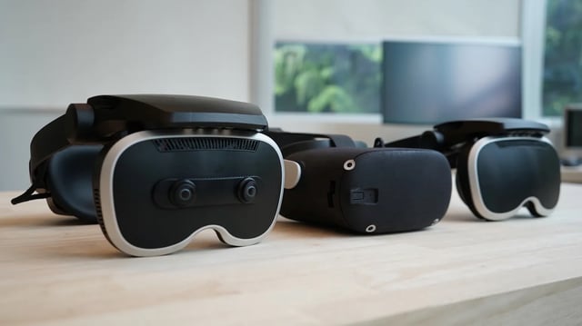A photo of three Meta prototype VR headsets on a table that'll be shown at SIGGRAPH 2025.