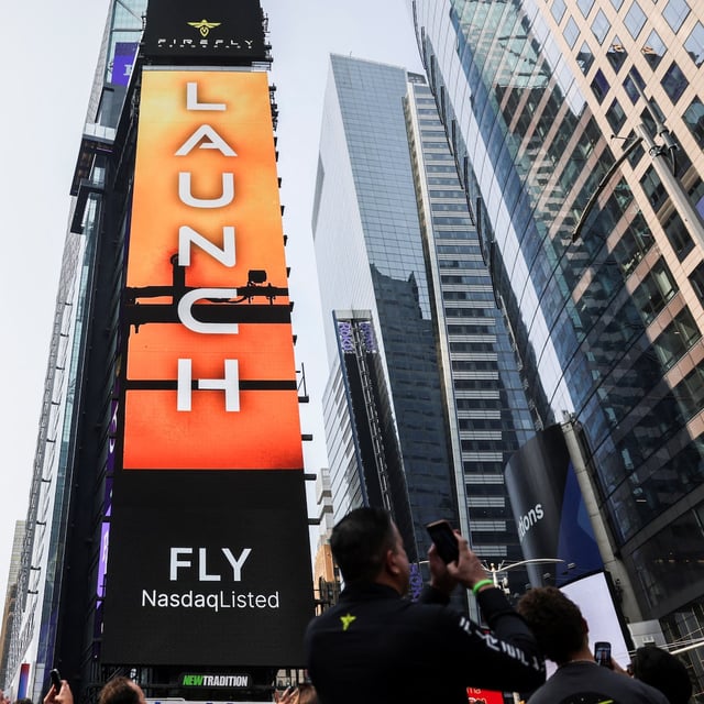 A screen displays the Firefly Aerospace logo during the company's IPO at the Nasdaq MarketSite in New York City, U.S.,August 7, 2025.