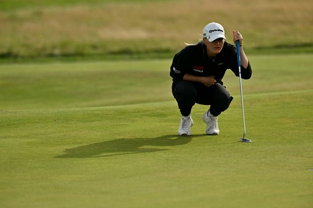 England&#39;s Charley Hull lines up a putt on the 18th green on the final day of the Women&#39;s British Open Golf Championship, at Royal Porthcawl in south Wales on August 3, 2025.