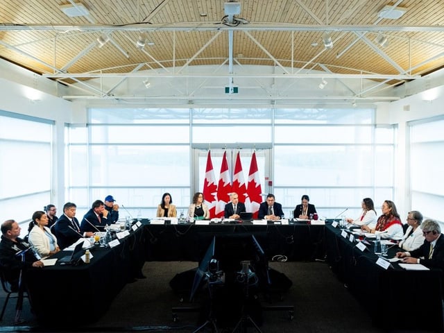 Prime Minister Mark Carney, centre, delivers opening remarks ahead of the Métis Major Projects Summit at the Royal Canadian Geographical Society in Ottawa, on Thursday, Aug. 7, 2025.