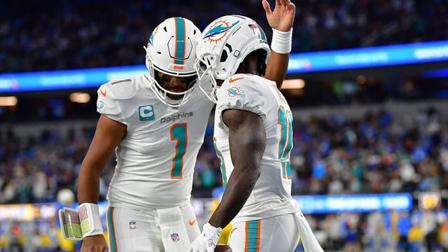 Dec 11, 2022; Inglewood, California, USA; Miami Dolphins wide receiver Tyreek Hill (10) celebrates his touchdown scored against the Los Angeles Chargers with quarterback Tua Tagovailoa (1) during the first half at SoFi Stadium. Mandatory Credit: Gary A. Vasquez-USA TODAY Sports