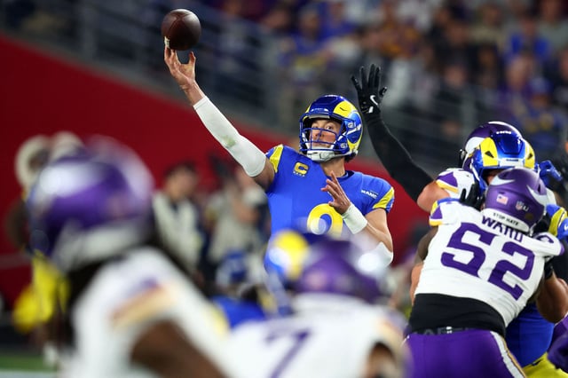 Jan 13, 2025; Glendale, AZ, USA; Los Angeles Rams quarterback Matthew Stafford (9) drops back to pass against the Minnesota Vikings during the second half in an NFC wild card game at State Farm Stadium. Mandatory Credit: Mark J. Rebilas-Imagn Images/File Photo