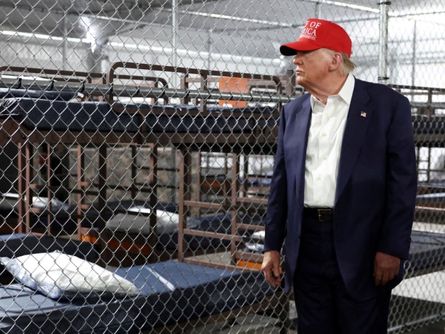 FILE PHOTO: U.S. President Donald Trump visits a temporary migrant detention center informally known as "Alligator Alcatraz" in Ochopee, Florida, U.S., July 1, 2025. REUTERS/Evelyn Hockstein/File Photo