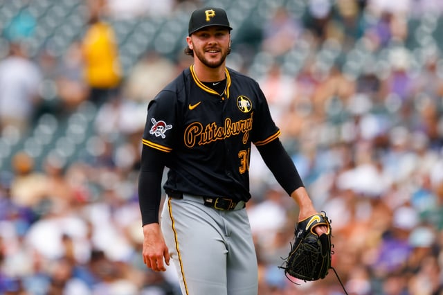 DENVER, CO - AUGUST 2: Starting pitcher Paul Skenes #30 of the Pittsburgh Pirates smiles as he walks off the field in the fourth inning against the Colorado Rockies at Coors Field on August 2, 2025 in Denver, Colorado.