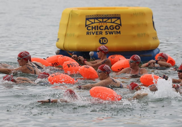 Swimmers start their race in the water off Ohio Street Beach, Sept. 22, 2024. (Brian Cassella/Chicago Tribune)