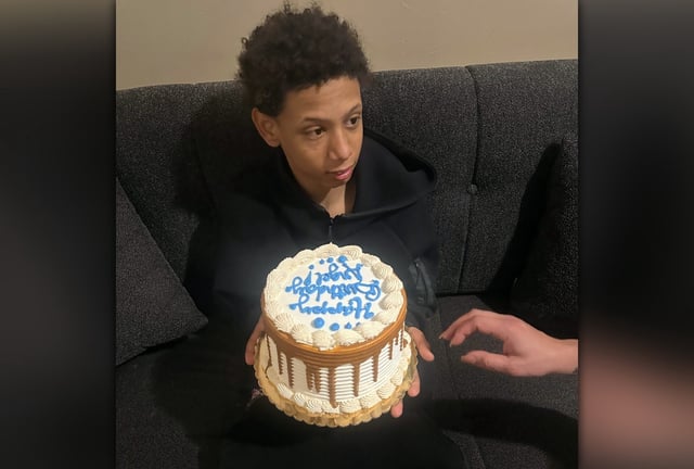 Stabbing victim Angel Mendoza is pictured holding his birthday cake as he celebrated his 14th birthday on June 8. (Courtesy of Family)