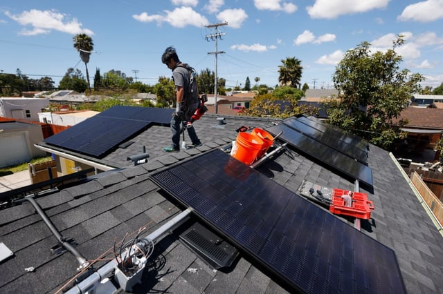 Miguel Cornelio of Stellar Solar works on a solar panel installation in North Park on Monday, April 15, 2024 in San Diego, CA. (K.C. Alfred / The San Diego Union-Tribune)