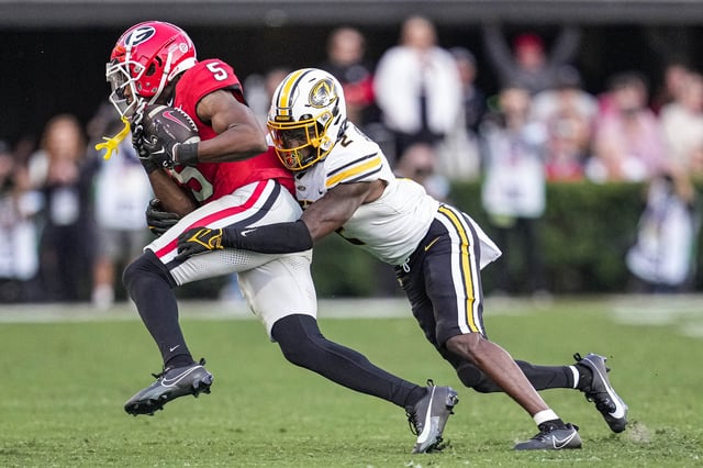 Nov 4, 2023; Athens, Georgia, USA; Georgia Bulldogs wide receiver Rara Thomas (5) is tackled by Missouri Tigers defensive back Ennis Rakestraw Jr. (2) during the second half at Sanford Stadium. Mandatory Credit: Dale Zanine-USA TODAY Sports/File Photo
