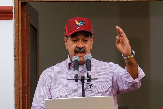 Venezuelan President Nicolas Maduro addresses supporters during a march marking the first anniversary of his victory in the disputed July 28 presidential election, in Caracas, Venezuela July 28, 2025. REUTERS/Leonardo Fernandez Viloria/File Photo