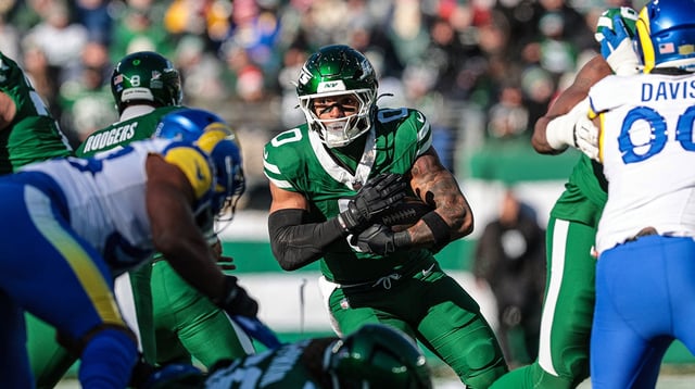 Dec 22, 2024; East Rutherford, New Jersey, USA; New York Jets running back Braelon Allen (0) carries the ball during the first half against the Los Angeles Rams at MetLife Stadium. Mandatory Credit: Vincent Carchietta-Imagn Images.