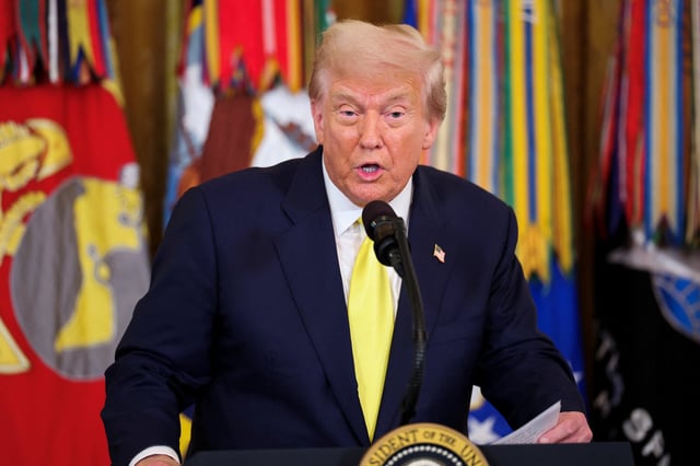 U.S. President Donald Trump speaks at a Purple Heart Day event to honor members of the military wounded or killed in action, in the East Room of the White House in Washington, D.C., U.S., August 7, 2025. REUTERS/Jonathan Ernst
