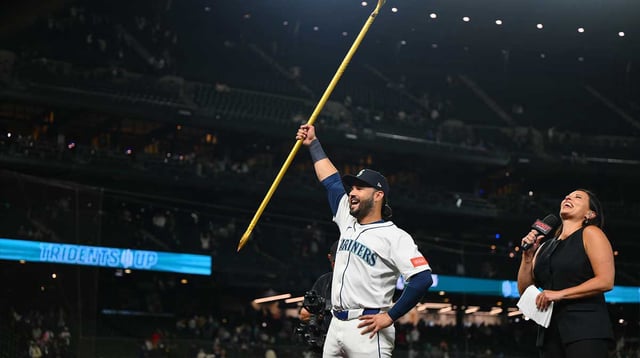 Aug 5, 2025; Seattle, Washington, USA; Seattle Mariners third baseman Eugenio Suarez (28) interacts with fans after the game against the Chicago White Sox at T-Mobile Park. Mandatory Credit: Steven Bisig-Imagn Images