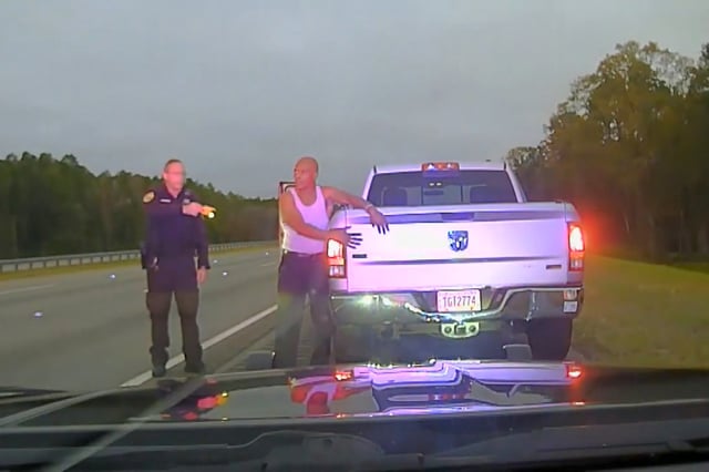 Then-Georgia deputy Buck Aldridge points a taser at Leonard Cure during a traffic stop.