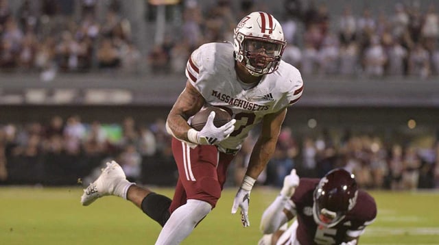 Nov 2, 2024; Starkville, Mississippi, USA; Massachusetts Minutemen running back CJ Hester (33) runs the ball against the Mississippi State Bulldogs during the fourth quarter at Davis Wade Stadium at Scott Field. Mandatory Credit: Matt Bush-Imagn Images