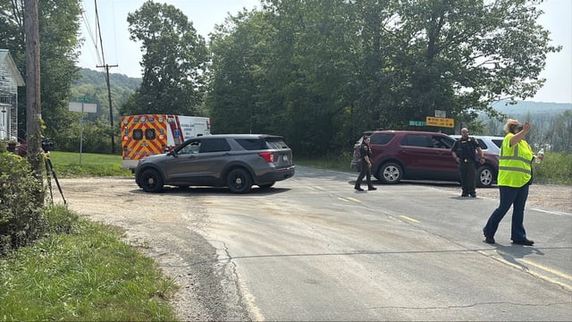 This image provided by WNEP shows police near the scene of a shooting where two state troopers were injured, Thursday, Aug. 7, 2025 near the village of Thompson in Susquehanna County, Pa. (WNEP via AP)