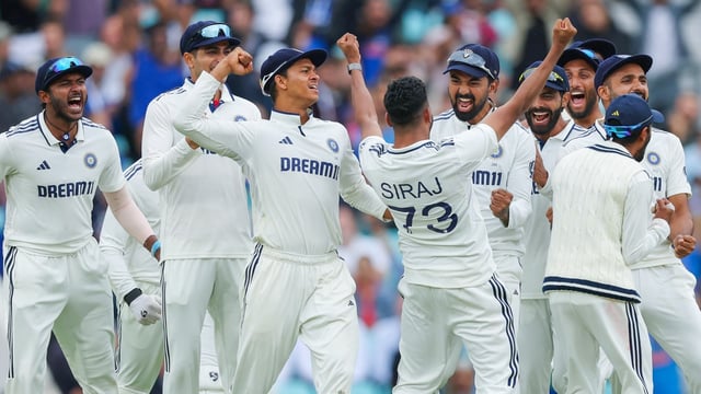  Indian players celebrate after defeating England by 6 runs in the 5th test match, at Kennington Oval stadium in London