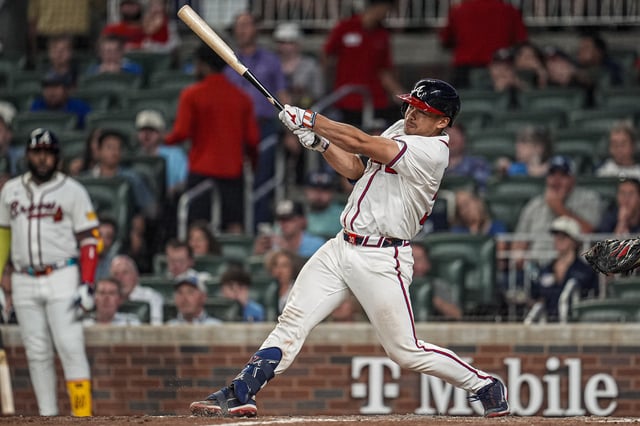 Aug 7, 2025; Cumberland, Georgia, USA; Atlanta Braves catcher Drake Baldwin (30) hits a three run home run against the Miami Marlins during the eighth inning at Truist Park. Mandatory Credit: Dale Zanine-Imagn Images