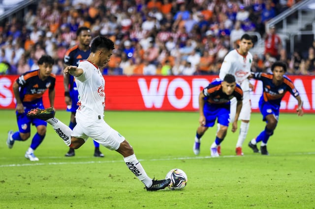 Aug 7, 2025; Cincinnati, OH, USA; Chivas de Guadalajara midfielder Efrain Alvarez (10) kicks a penalty kick against FC Cincinnati in the first half at TQL Stadium. Mandatory Credit: Katie Stratman-Imagn Images