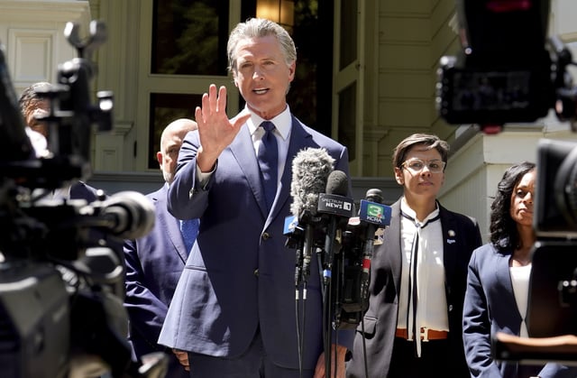 California Gov. Gavin Newsom calls for a new way for California to redraw it's voting districts during a news conference In Sacramento, Calif., Friday July 25, 2025. (AP Photo/Rich Pedroncelli)