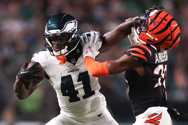 Aug 7, 2025; Philadelphia, Pennsylvania, USA; Philadelphia Eagles wide receiver Darius Cooper (41) runs with the ball against Cincinnati Bengals safety Tycen Anderson (26) after a catch during the second quarter at Lincoln Financial Field. Mandatory Credit: Bill Streicher-Imagn Images