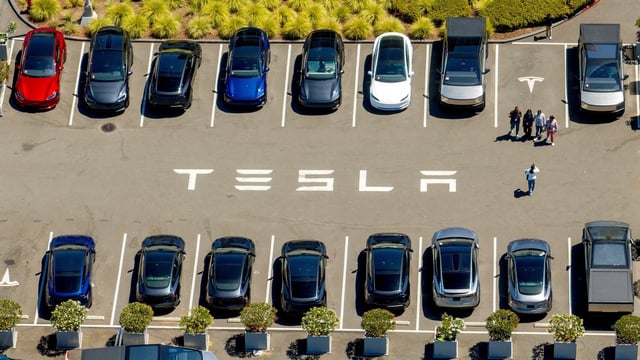 Tesla vehicles line a parking area at the company's Fremont