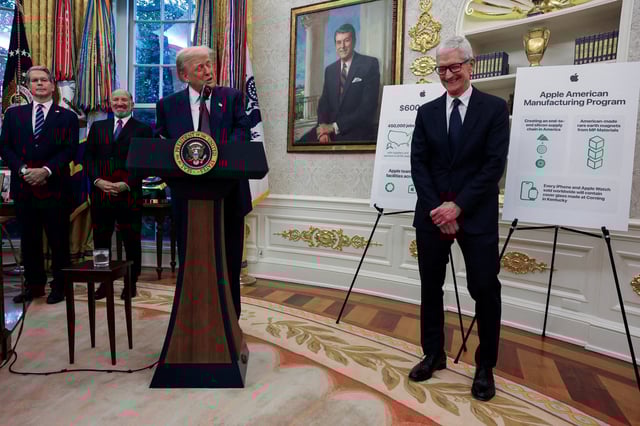 Apple CEO Tim Cook reacts while President Donald Trump speaks in the Oval Office at the White House on Aug. 6, 2025.