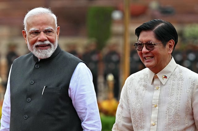 Philippine President Ferdinand Marcos, right, listens to India&#39;s Prime Minister Narendra Modi during the ceremonial reception at India&#39;s presidential palace Rashtrapati Bhavan in New Delhi on August 5, 2025.