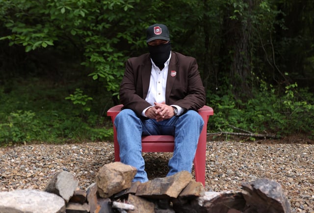 Henry Stout, a member of the white nationalist group Aryan Freedom Network, conceals his identity during a portrait session in southern Oklahoma, U.S., May 5, 2025.