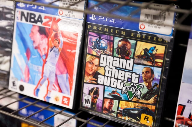 NBA 2K22 and Grand Theft Auto 5 by Take-Two Interactive Software Inc are seen for sale in a store in Manhattan, New York City, U.S., February 7, 2022. REUTERS/Andrew Kelly/File Photo