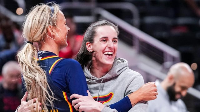 Indiana Fever Sophie Cunningham (8) hugs Indiana Fever Caitlin Clark (22) on Saturday, May 3, 2025, during a preseason game between the Indiana Fever and the Washington Mystics at Gainbridge Fieldhouse in Indianapolis. The Indiana Fever defeated the Washington Mystics in overtime, 79-74.