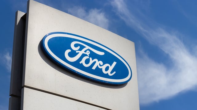Krasnoyarsk, Russia - May 19, 2022: Close-up Ford brand logo on against blue sky background. Dealership centre of car shop