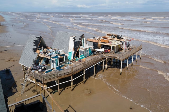 TOPSHOT - An aerial view shows a destroyed home in Surfside Beach, Texas, on July 8, 2024, after Hurricane Beryl made landfall. Hurricane Beryl made landfall July 8 in the southern US state of Texas, killing at least two people and causing millions to lose power amid dangerous winds and flooding, as some coastal areas remained under evacuation orders. (Photo by Mark Felix / AFP) (Photo by MARK FELIX/AFP via Getty Images)