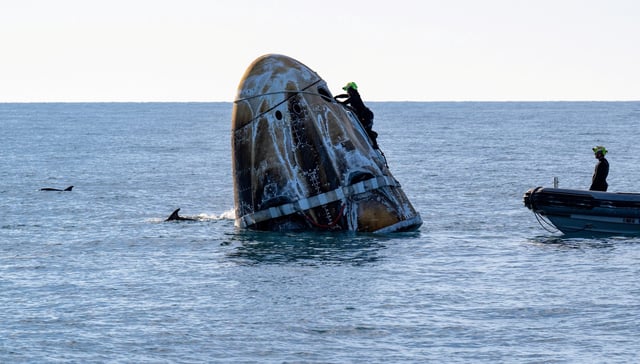 The SpaceX Dragon spacecraft floats off the coast of Florida as support teams work to recover the vehicle. NASA astronauts Nick Hague, Suni Williams, Butch Wilmore, and Roscosmos cosmonaut Aleksandr Gorbunov returned on the capsule Tuesday evening after departing the International Space Station.