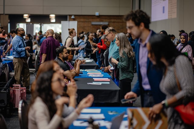 Recruiters and job seekers speak during a job fair in Chicago, Illinois on June 26th.