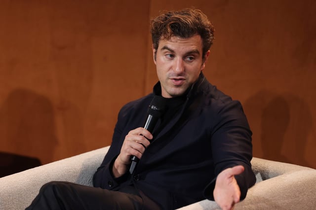 Brian Chesky, co-founder and CEO of Airbnb, attends the announcement of the first-ever global live music partnership, launching immersive fan experiences at Lollapalooza festivals worldwide on May 26, 2025 in Berlin, Germany.