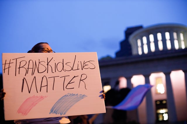 Trans rights activist holding sign which reads, &#39;trans kids lives matter&#39;. (Stephen Zenner/SOPA Images/LightRocket via Getty Images)