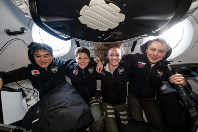 From left, NASA&#39;s SpaceX Crew-10 members JAXA astronaut Takuya Onishi, NASA astronauts Anne McClain and Nichole Ayers, and Roscosmos cosmonaut Kirill Peskov pose for a portrait inside the SpaceX Dragon crew spacecraft that carried them to the International Space Station and will return them back to Earth. (NASA)