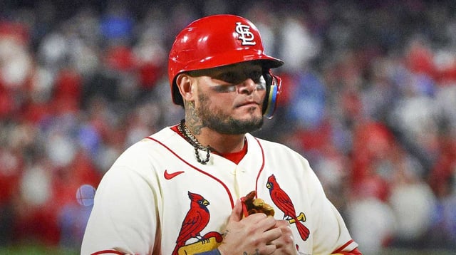 Oct 8, 2022; St. Louis, Missouri, USA; St. Louis Cardinals catcher Yadier Molina (4) walks off the field after hitting a single for his final postseason at bat in the ninth inning against the Philadelphia Phillies during game two of the Wild Card series for the 2022 MLB Playoffs at Busch Stadium. Mandatory Credit: Jeff Curry-Imagn Images