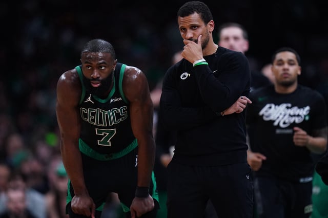 Celtics coach Joe Mazzulla talks with guard Jaylen Brown during the NBA playofs.