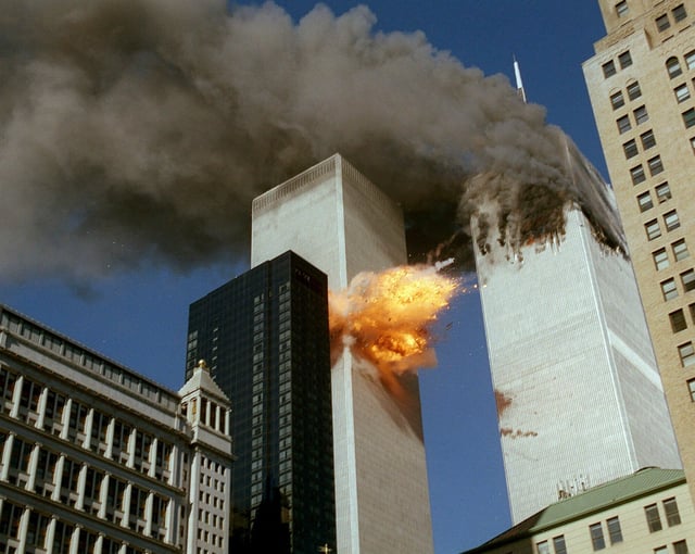 FILE - In this Sept. 11, 2001 file photo, United Airlines Flight 175 collides into the south tower of the World Trade Center in New York as smoke billows from the north tower. (AP Photo/Chao Soi Cheong, file)