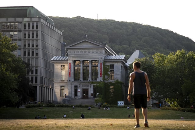 People play frisbee on the McGill University campus in Montreal on Wednesday, August 6, 2025.