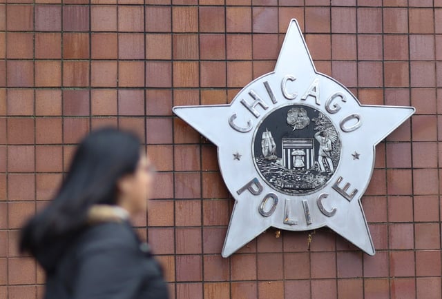 A person walks past Chicago Public Safety Headquarters on Dec. 1, 2023. (Talia Sprague/Chicago Tribune)
