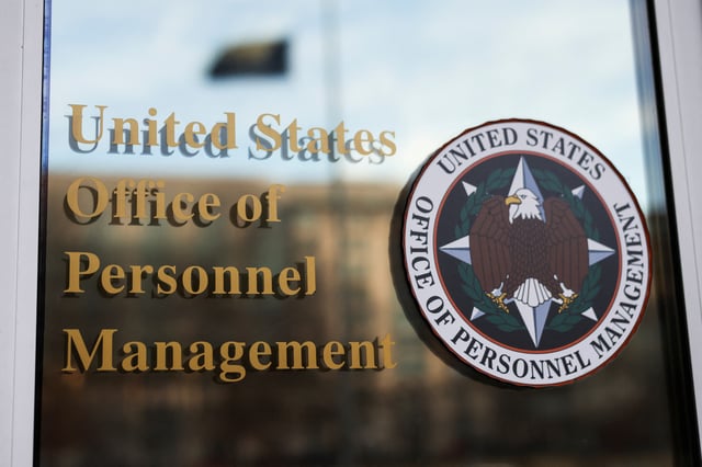 A view shows the logo of the Office of Personnel Management (OPM), after probationary staff at the OPM were fired in a conference call and given less than an hour to leave the building, outside OPM in Washington, D.C., U.S., February 13, 2025. REUTERS/Tierney L. Cross/File Photo