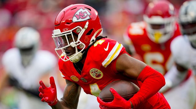 Dec 25, 2023; Kansas City, Missouri, USA; Kansas City Chiefs wide receiver Rashee Rice (4) runs with the ball against the Las Vegas Raiders during the first half at GEHA Field at Arrowhead Stadium. Mandatory Credit: Jay Biggerstaff-Imagn Images