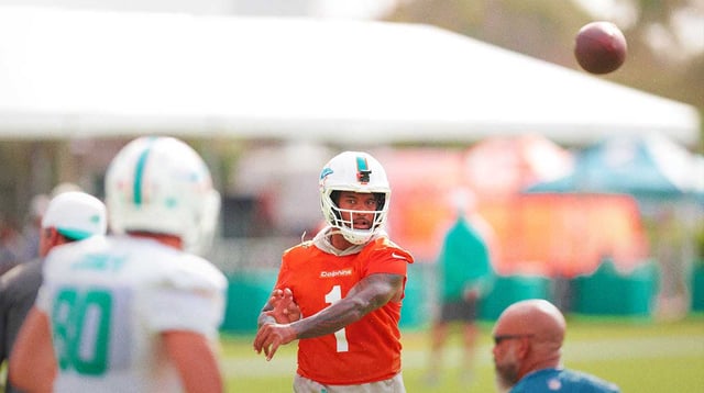 Jul 28, 2025; Miami Gardens, MI, USA; Miami Dolphins quarterback Tua Tagovailoa (1) throws the football during training camp at Baptist Health Training Complex.