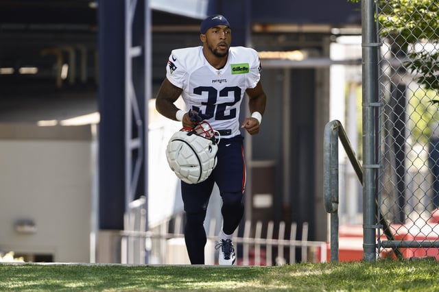 FOXBOROUGH, MA - JULY 28: TreVeyon Henderson #32 of the New England Patriots heads to the field during training camp at Gillette Stadium on July 28, 2025 in Foxborough, Massachusetts.