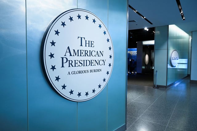 Signage for the exhibition titled "The American Presidency: A Glorious Burden" is displayed inside the Smithsonian's National Museum of American History on August 1.