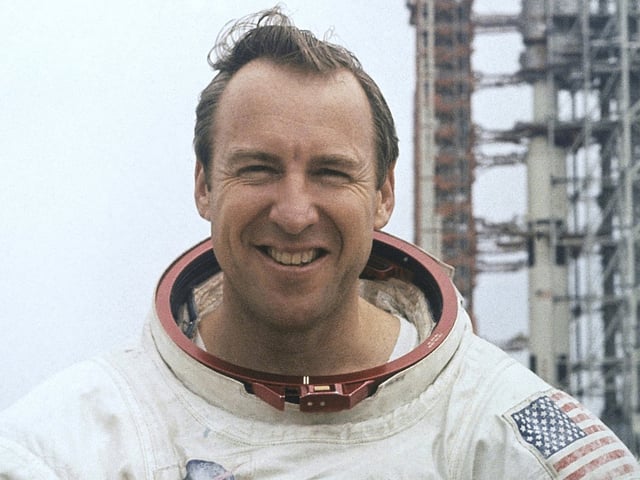 FILE - In this photo provided by NASA, astronaut James Lovell, Apollo 13 commander poses for a portrait in his space suit, Feb. 16, 1970. (AP Photo/NASA, File)