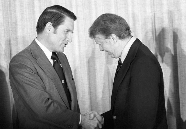 FILE - William H. Webster, left, is congratulated by President Jimmy Carter after being sworn in as new director of the FBI in Washington, Feb. 23, 1978. (AP Photo/Harvey Georges, File)